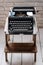 Antique typewriter. Vintage typewriter machine closeup retro styled.