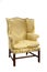 Antique upholstered wing arm chair on white