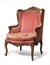 Antique upholstered wing chair