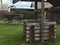 Antique vintage Russian rural peasant cart in the yard of a wooden house