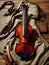 An antique violin lies canvas, on a wooden table.