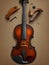 An antique violin lies on the table.