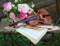 Antique violin, notes and spring bouquet