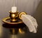 Antique wax candle, gold-plated with a feather