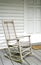 Antique White Rocking Chair on Porch