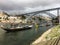 Antique winery boats moored at Douro river banks in Porto, Portu