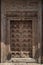 Antique wodden door covered with fantastic carvings.