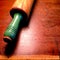 Antique wood rolling pin with painted green handle