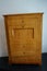 Antique wooden bureau, chest of drawers, located in a Gothic house in the old town of Spandau.