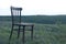 Antique wooden chair. Relax on the grass. Loneliness and depression concept.