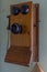 Antique wooden crank telephone on the wall