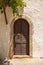 Antique wooden door with metal decor