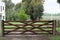 Antique wooden gate closure at the entrance to the farm or ranch