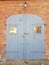 Antique wooden gray door in Storkow