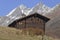 Antique wooden houses from old village from Zermatt with Matterhorn peak in background