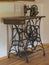Antique wooden iron sewing machine in attic room