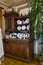 Antique wooden kitchen furniture and dishes in the interior of the 19th century mansion