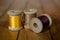 Antique wooden spools of thread in warm colors