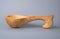 Antique wooden spoon on a gray studio background. Carved wooden scoop. Old wooden utensils for eating soup. Empty ladle