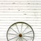 Antique Wooden Wagon Wheel on Rustic White Background