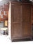 Antique wooden wardrobe in the dusty attic