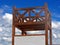 Antique wooden watchtower against sky