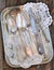 Antiques - cutlery, spoons, forks, knives on a tray