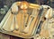 Antiques - cutlery, spoons, forks, knives on a tray, image is tinted