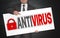 Antivirus poster is held by businessman