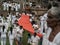 ANURADHAPURA, SRI LANKA - March 9, 2019: Pilgrims carry long new orange cloth