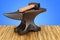 Anvil and hammer on the wooden table. 3D rendering