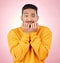 Anxiety, portrait and asian man biting nails in studio with terror, fear and shocking drama on pink background. Stress