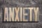 Anxiety word burned wood