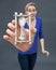 Anxious beautiful young woman holding a stressful hour glass