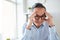 Anxious businessman in eyeglasses at office