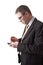 Anxious businessman with smartphone