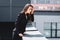 anxious businesswoman, suffering from acrophobia, standing on rooftop and looking down.