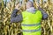 Anxious farmer on cold corn field