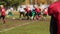 Anxious football player watching game, defocused rival teams fighting for ball