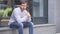 Anxious Serious Handsome Man Sitting Outside Office