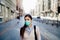 Anxious young adult affected by the COVID-19.Walking,going to work during pandemic.Protective measures,mask wearing and social