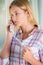 Anxious Young Woman Phoning Helpline