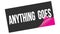 ANYTHING  GOES text on black pink sticker stamp