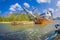 AO NANG, THAILAND - FEBRUARY 09, 2018: Outdoor view of huge boat with a ramp, sailing in the river at with a blurred