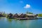 AO NANG, THAILAND - FEBRUARY 19, 2018: Outdoor view of traditional Thai seafood restaurant on stilts over the water in