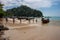 Ao Nang, Thailand - November 27, 2015: Tourists walk the chain on a long boat to sail to Railay Beach.