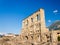 AOSTA, ITALY-JUNE 17,2019: The roman theather of Aosta is of roman period with a facade pierced by arches and windows 22 metres