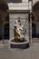 Aosta, Italy. Triton statue of the fountain placed in front of the facade of the Town Hall in Ã‰mile Chanoux Square.