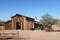 APACHE JUNCTION, ARIZONA - DECEMBER 8, 2016: Apacheland Barn with the  Elvis Memorial Chapel in the background at the Superstition