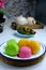 Apam beras or steamed rice cake is a traditional Malay dessert on white plate.